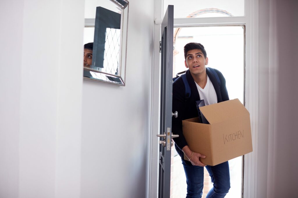 Young man moving into home